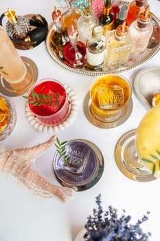 Five colorful summer cocktails in glasses on white table. Assortment of fresh summer drinks. Orange and red sangria cocktails, orange punch cocktail, margarita cocktail, tropical mule.