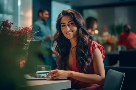 An inspiring image of a young businesswoman confidently working on her laptop, showcasing professionalism and ambition.