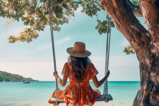 A traveler woman finds tranquility and relaxation as she swings above the crystal-clear waters of the Andaman Sea.