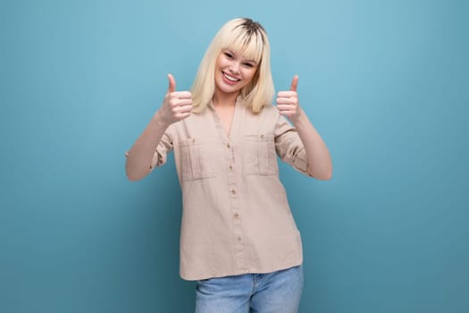 happy successful blonde young lady on background with copyspace.