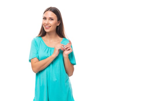 portrait of a 30 year old pretty brunette woman with black flowing hair on a background with copy space.