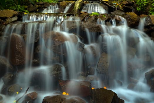 Landscape of multilevel waterfalls in Dlundung, Trawas, Mojokerto. Indonesia. Long Exposure Nature Photography.