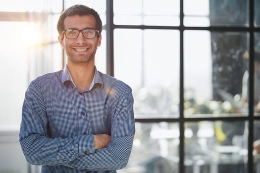 Portrait of a handsome businessman in his office