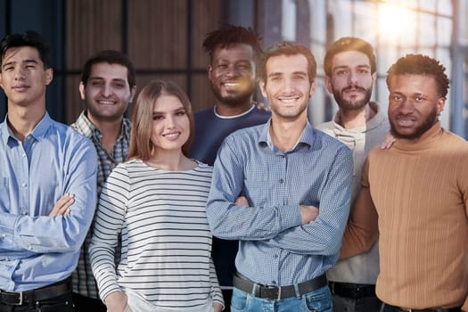 Everybody brings a different skill to the team. Portrait of a diverse group of coworkers standing in an office.