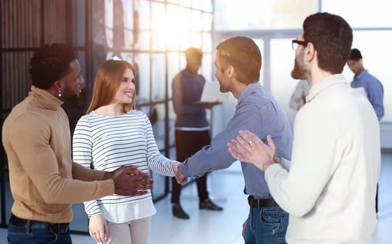 Shot of a group of businesspeople networking at a conference