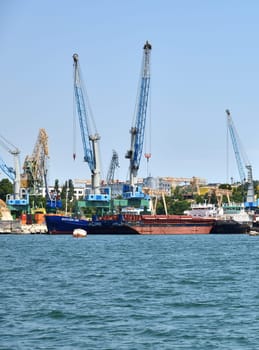 Sevastopol, Crimea - July 3, 2019. Sevastopol, Crimea - July 3, 2019. Dock bay with cranes for a ship repair