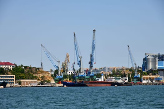 Sevastopol, Crimea - July 3, 2019. Sevastopol, Crimea - July 3, 2019. Dock bay with cranes for a ship repair