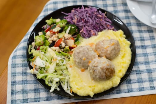 Home made meat dish with salads, in hands dinner cutlet. High quality photo