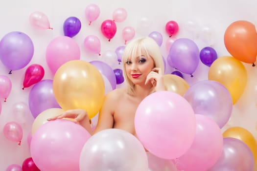 Image of sensual platinum blonde smiling at camera