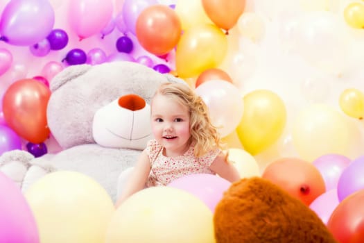 Image of emotional little girl playing in game room