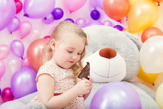 Image of lovely young girl playing in game room