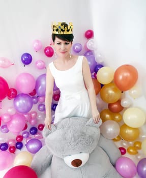 Image of elegant adult woman posing like little princess