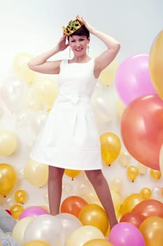 Image of beautiful adult woman fooling around in studio