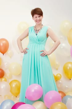 Image of pretty elegant middle-aged woman winks at camera