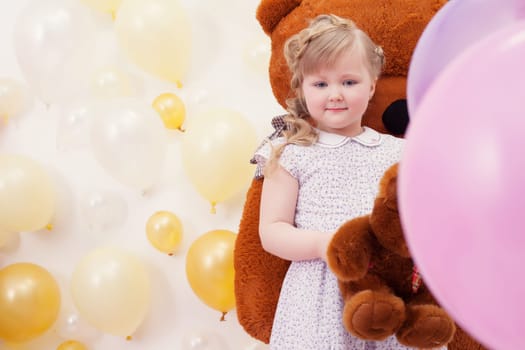 Image of pretty neat girl posing at camera in playroom