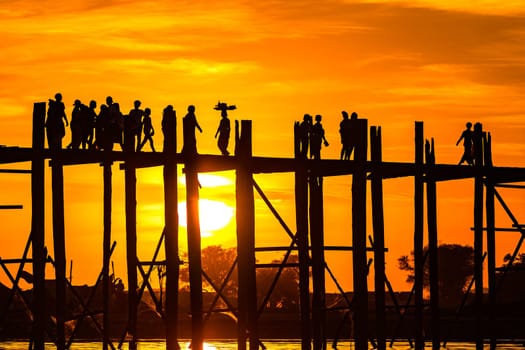 Spectacular sunset with picturesque sunset at the famous U-Pein-Bridge near Mandalay, Myanmar, Burma, Southeast Asia, Asia