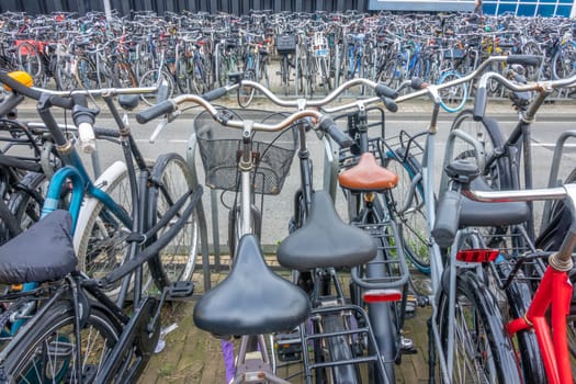 Netherlands. Part of a giant outdoor bicycle parking near Amsterdam Central Station