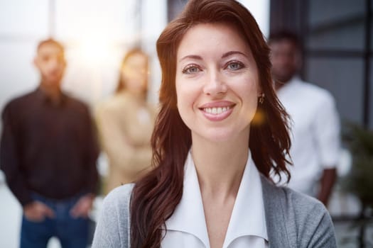 Portrait of a young business woman standing in the office