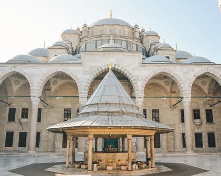 Fatih Mosque or Conqueror's Mosque in Istanbul, Turkey. Beautiful Fatih camii is landmark of Istanbul. Panorama of mosque courtyard, old muslim Turkish architecture. Travel, culture and tourism theme.