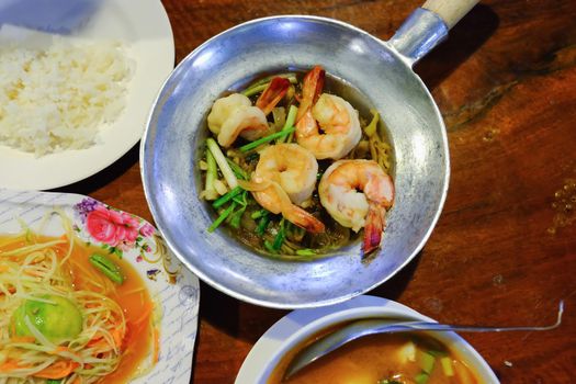 Tom Yum Goong on wood table, Thai Food