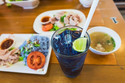 purple blue color herbal drink on meal table