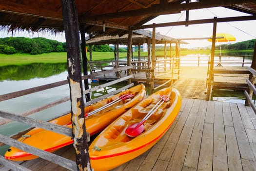 two kayaks park at river