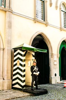 Lisbon, Portugal- 20 May, 2018: National guard doing surveillance at the door of the headquarters in Lisbon in Spring.