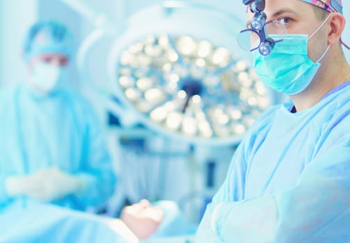 Male surgeon on background in operation room.