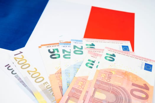 Euro banknote on France flag.