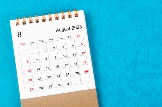 August 2023 Monthly desk calendar for 2023 year on blue background.