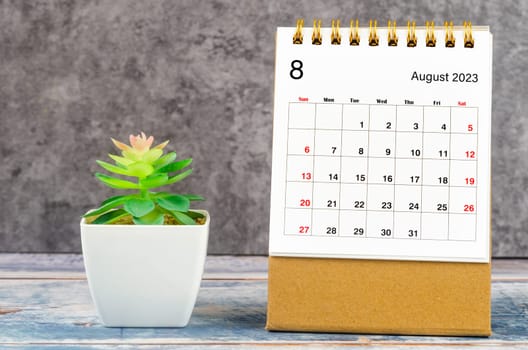 August 2023 Monthly desk calendar for 2023 year with plant pot.