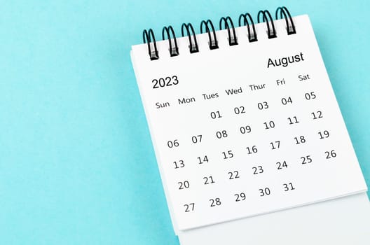 August 2023 Monthly desk calendar for 2023 year on blue background.