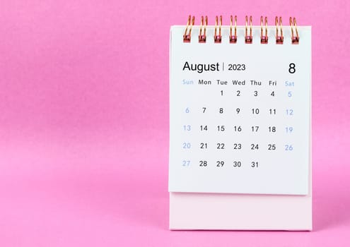 August 2023 Monthly desk calendar for 2023 year on pink colour background.