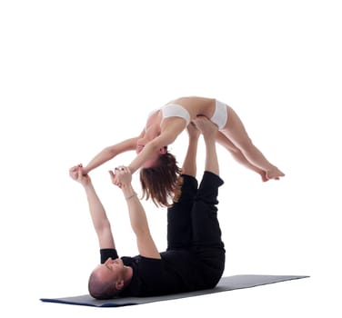 Couple of flexible yogis, isolated on white background