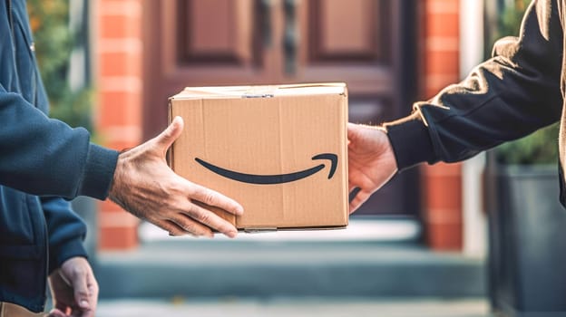 Faceless delivery man holding Amazon prime cardbox parcel box blurred street background. Generative ai