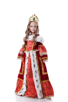 Smiling little girl posing in royal dress, isolated on white