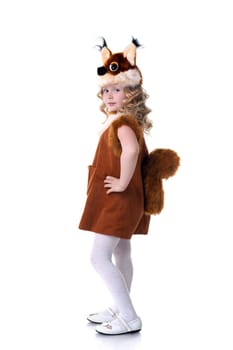 Nice little girl dressed as squirrel posing at camera