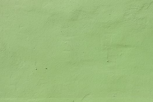 Texture of concrete green wall with time damaged plaster.