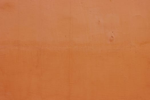 Texture for design with copy space. Concrete wall with orange plaster. Decorative wall surface .