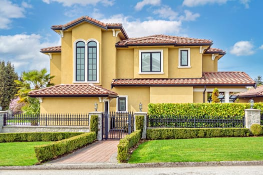 A perfect neigbourhood. Luxury family house on cloudy sky background