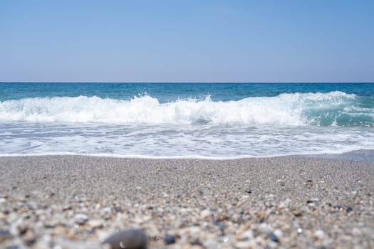 Sea waves run on the shore of the sea or ocean. Beautiful relaxing view on vacation.