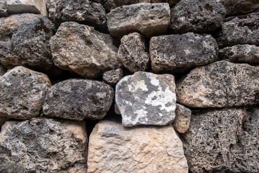 Texture of a stone wall. Old castle stone wall texture background. Stone wall as a background or texture. Part of a stone wall, for background or texture