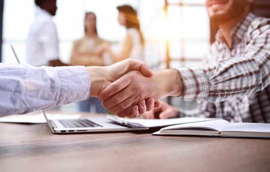 businessman shaking hands businessman in the office. success concept