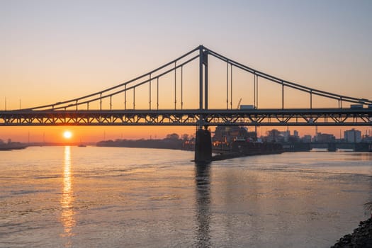 Old bridge crossing the Rhine river during sunset, Krefeld, North Rhine Westphalia, Germany