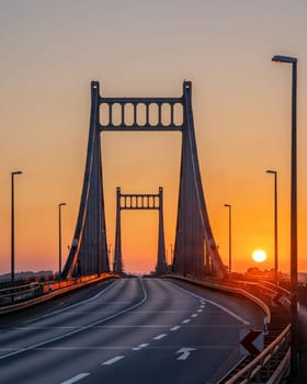 Old bridge crossing the Rhine river during sunrise, Krefeld, North Rhine Westphalia, Germany