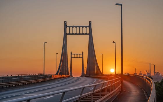 Old bridge crossing the Rhine river during sunrise, Krefeld, North Rhine Westphalia, Germany