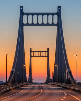 Old bridge crossing the Rhine river during sunrise, Krefeld, North Rhine Westphalia, Germany