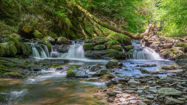 Panoramic image of a small creek cascading through a mystic valley, Eifel area, Rhineland-Palatinate, Germany