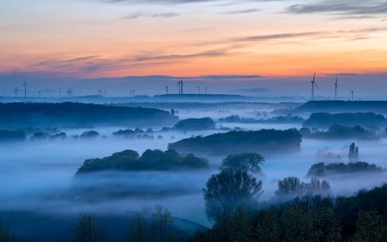 Evening mood, hills of Lower Rhine during sunset with evening fog, North Rhine Westphalia, Germany