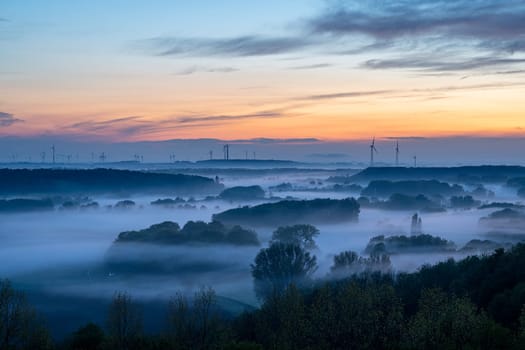 Evening mood, hills of Lower Rhine during sunset with evening fog, North Rhine Westphalia, Germany